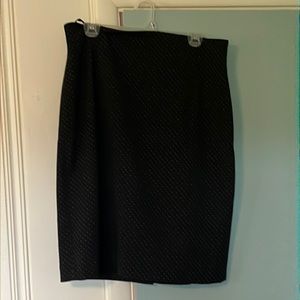 Above the knee, black fitted skirt